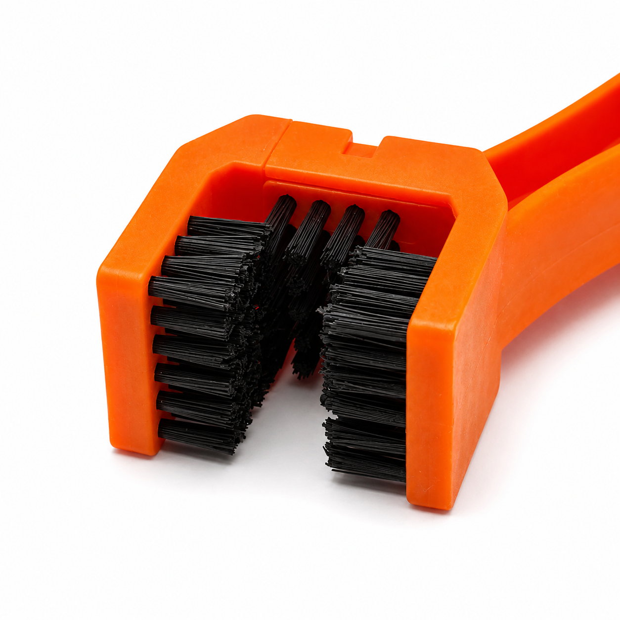 RevShine Products chain and sprocket cleaning brush for dirtbike chains, with stiff bristles for effective cleaning.