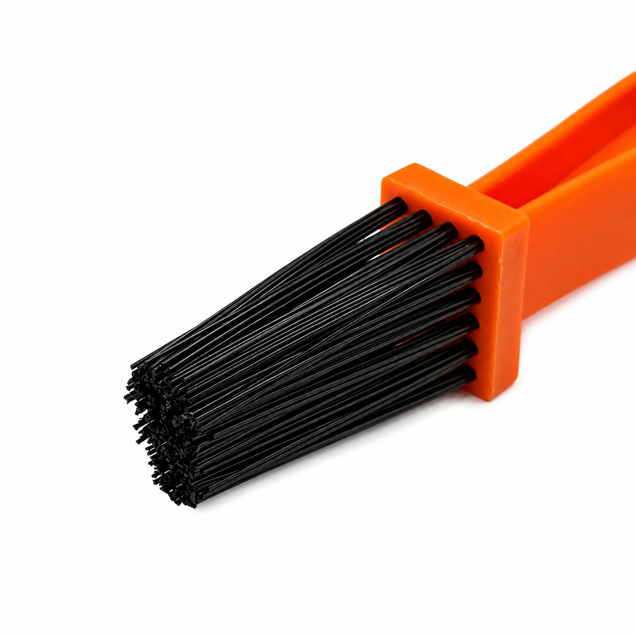 RevShine Products chain and sprocket cleaning brush used for dirtbike chain maintenance, with stiff bristles for deep cleaning.